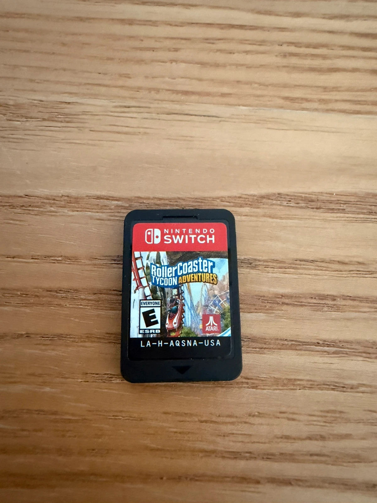 originals RollerCoaster Tycoon Adventures Nintendo Switch game cartridge with original case and cover.