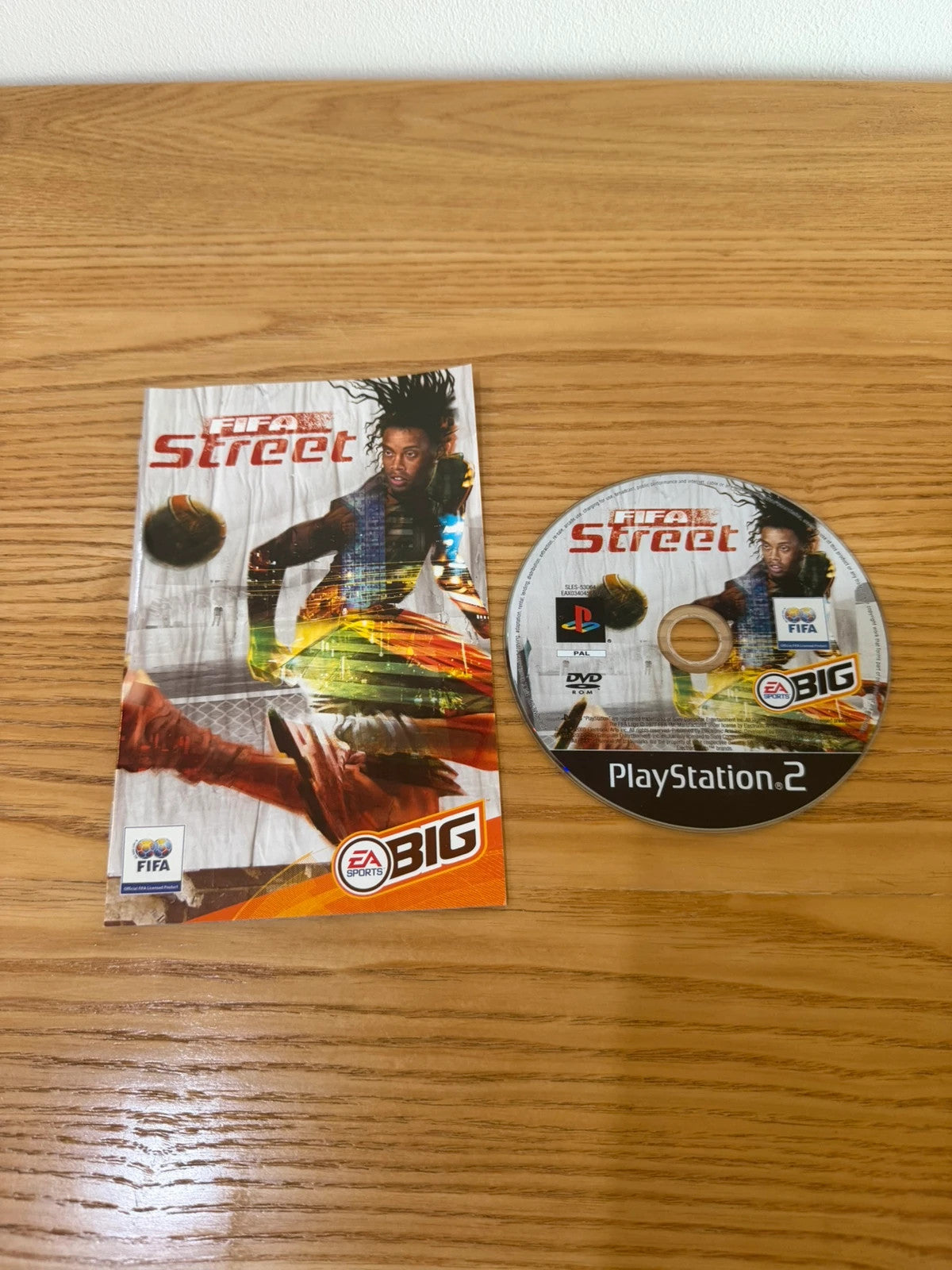 Multiples FIFA Street PS2 game complete with manual, very good condition, slight surface marks.