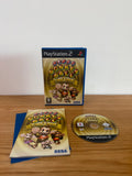 Multiples cream video game accessory with Super Monkey Ball Deluxe cover art and manual.