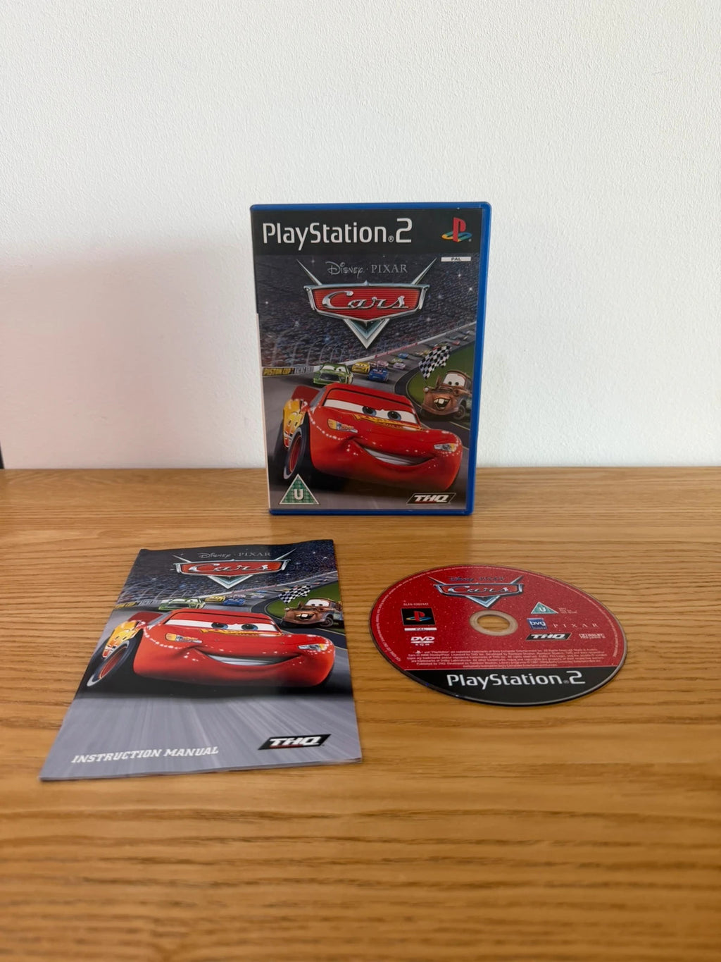 Disney Pixar Cars PS2 game complete with manual, case, and disc in very good condition.