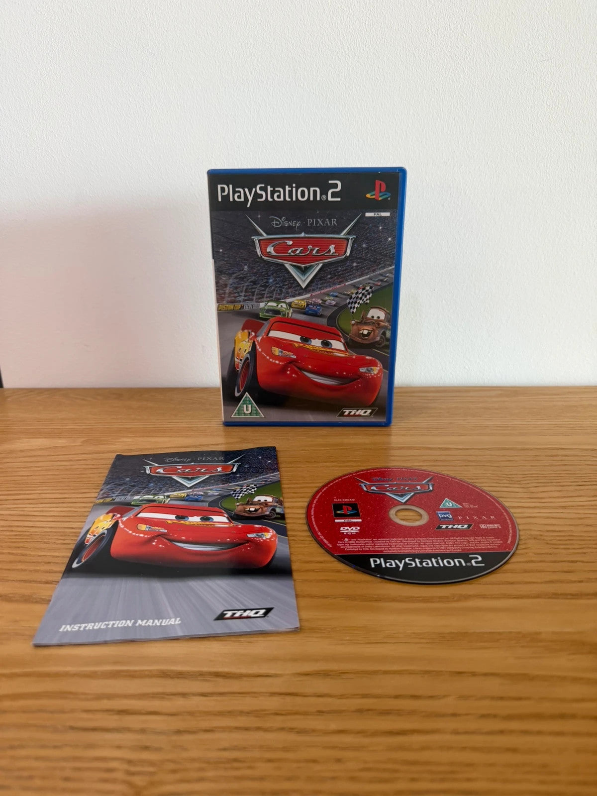 Disney Pixar Cars PS2 game complete with manual, case, and disc in very good condition.