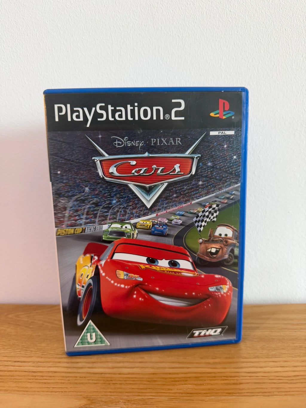 Disney Pixar Cars PS2 game complete with manual, case, and disc in very good condition.