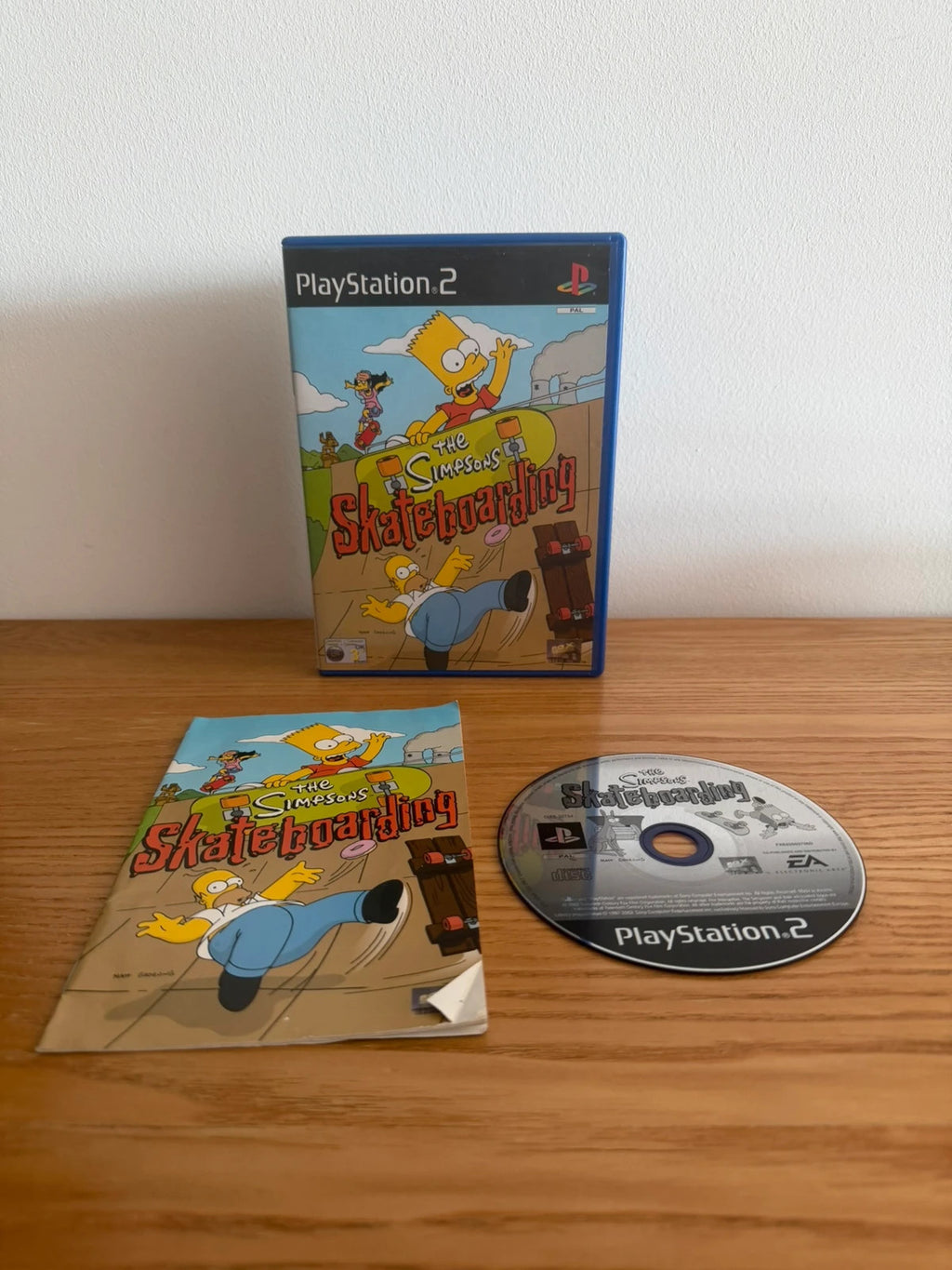 Multiples video game accessory The Simpsons Skateboarding PS2 complete with manual and case.