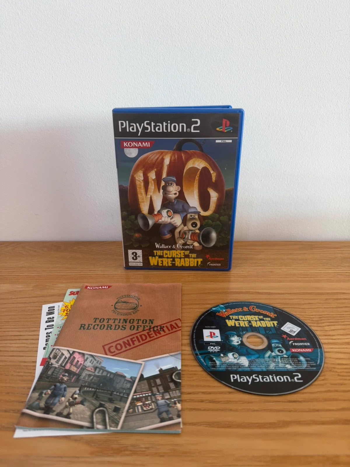 Multiples video game accessory Wallace & Gromit PS2 game case with manual and disc.