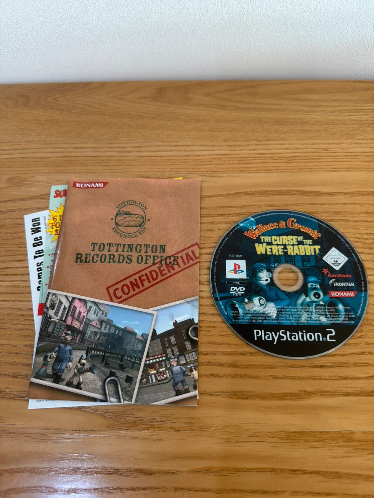 Multiples video game accessory Wallace & Gromit PS2 game case with manual and disc.