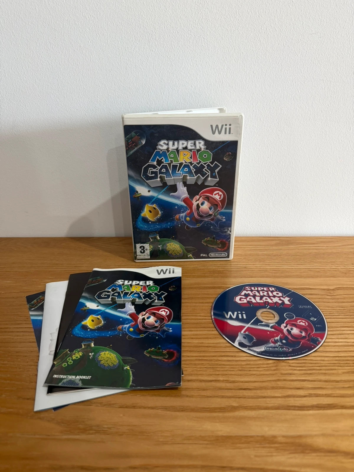 Nintendo Wii Super Mario Galaxy game complete with case, disc, cover, and manual.