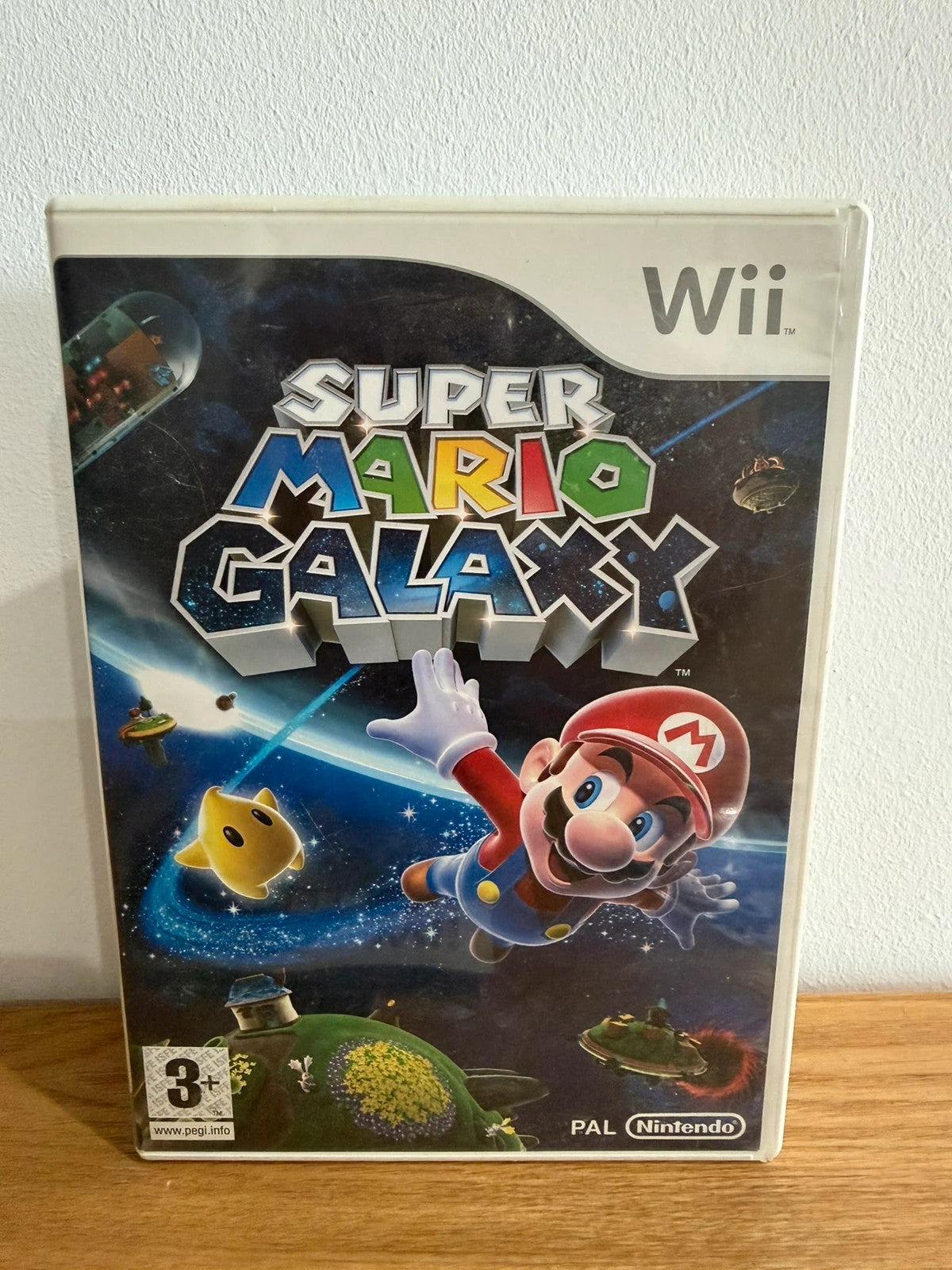 Nintendo Wii Super Mario Galaxy game complete with case, disc, cover, and manual.