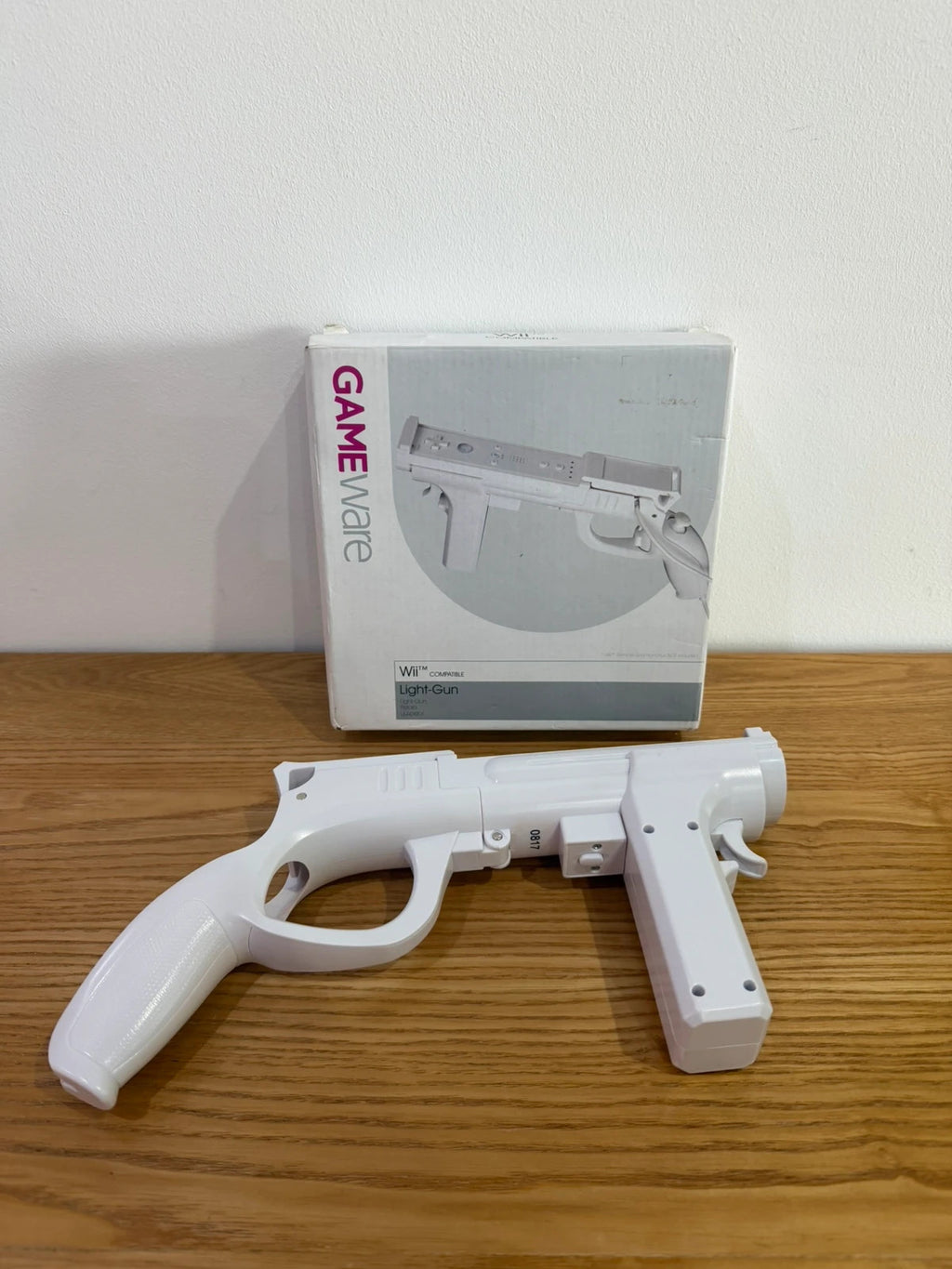 GameWare white Wii compatible light gun in original box, very good condition.