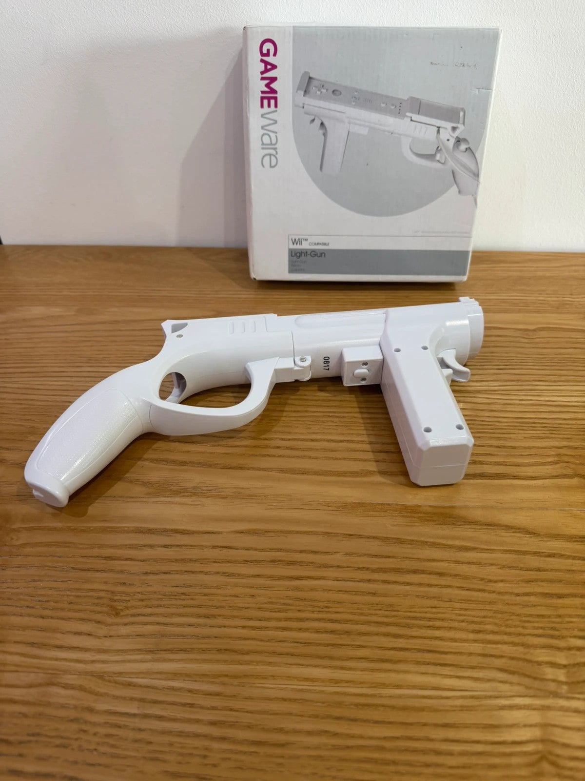 GameWare white Wii compatible light gun in original box, very good condition.