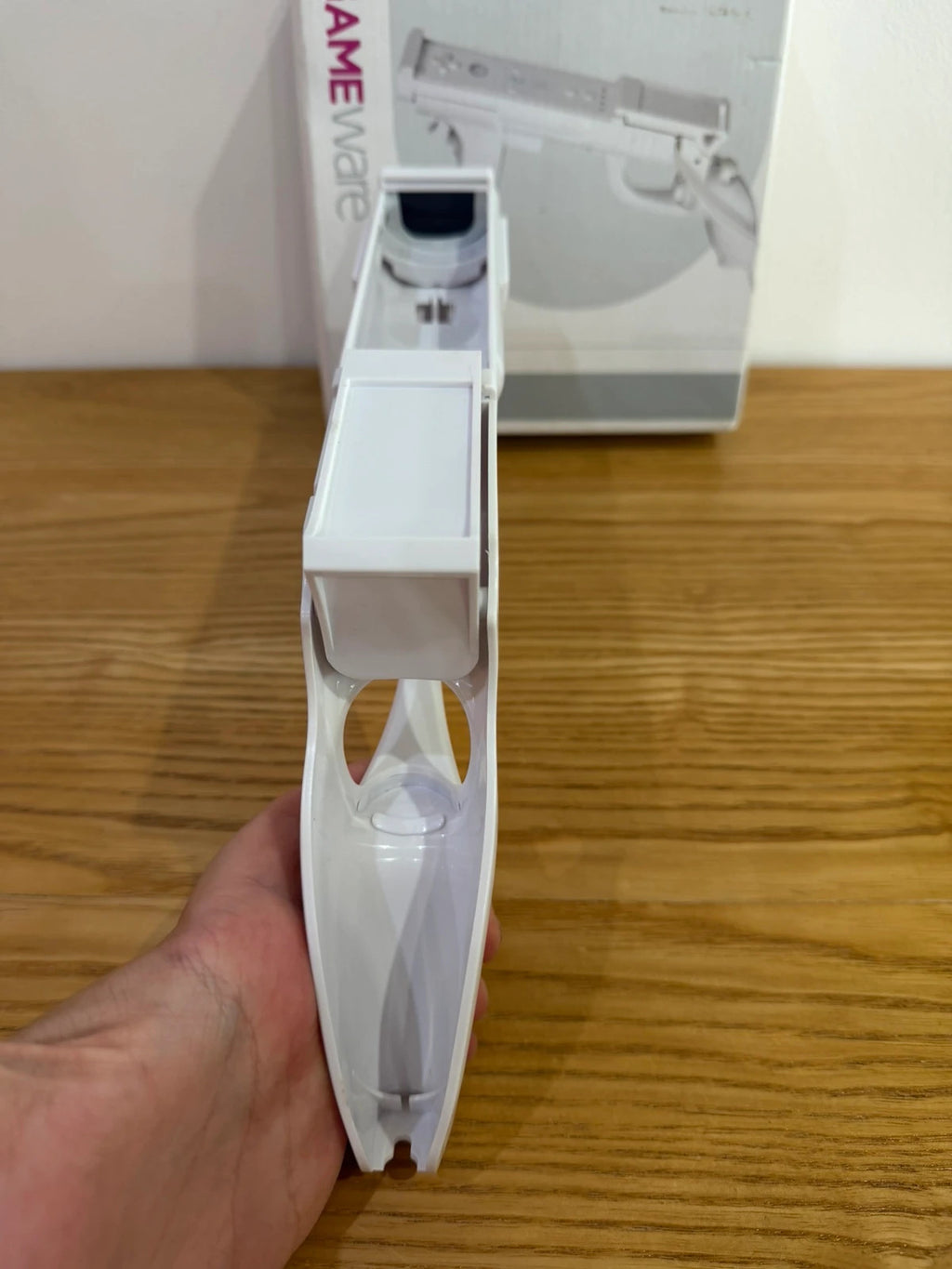 GameWare white Wii compatible light gun in original box, very good condition.