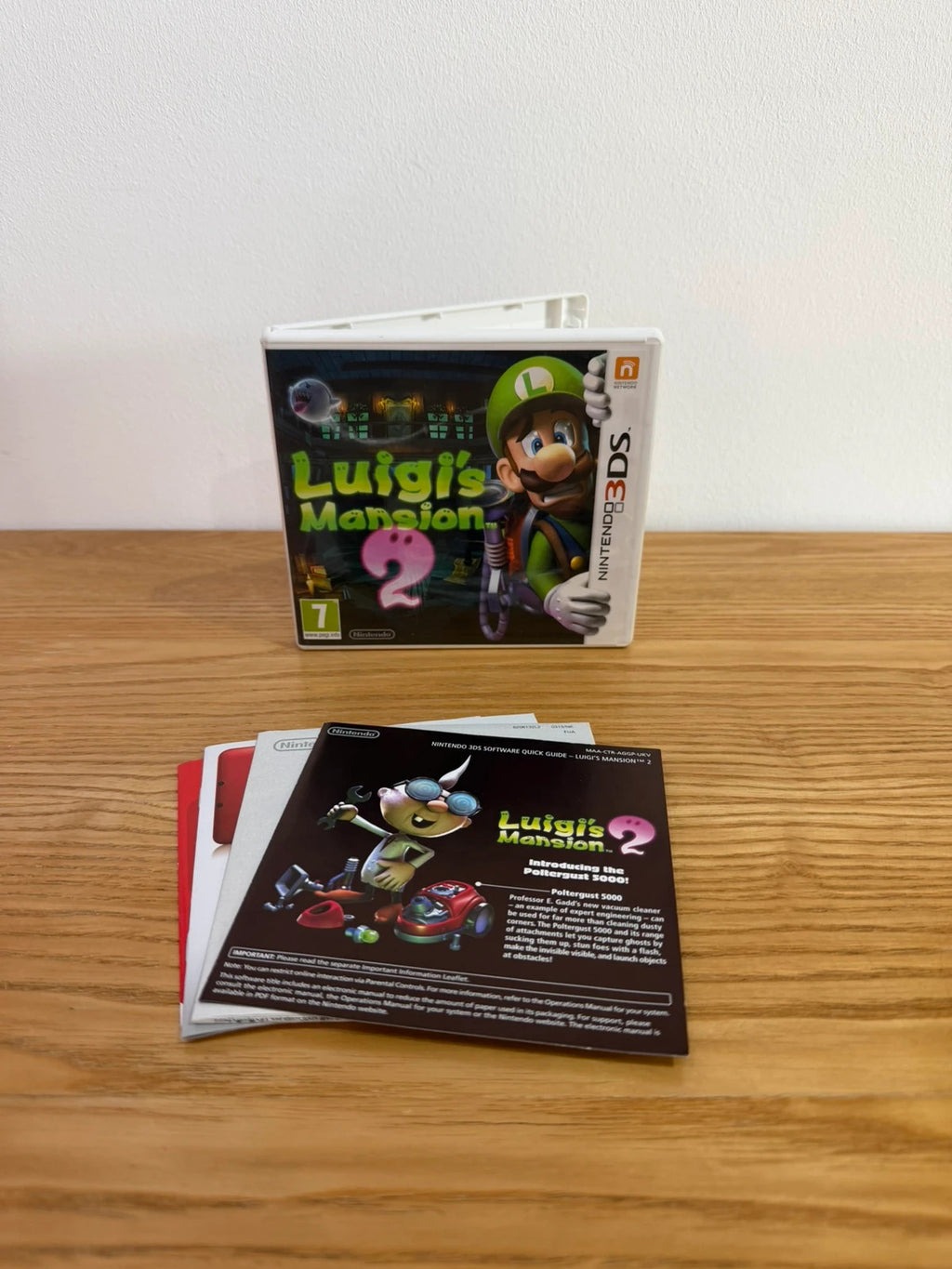 Luigi's Mansion 2 Nintendo 3DS game case with cover artwork and inserts, very good condition.
