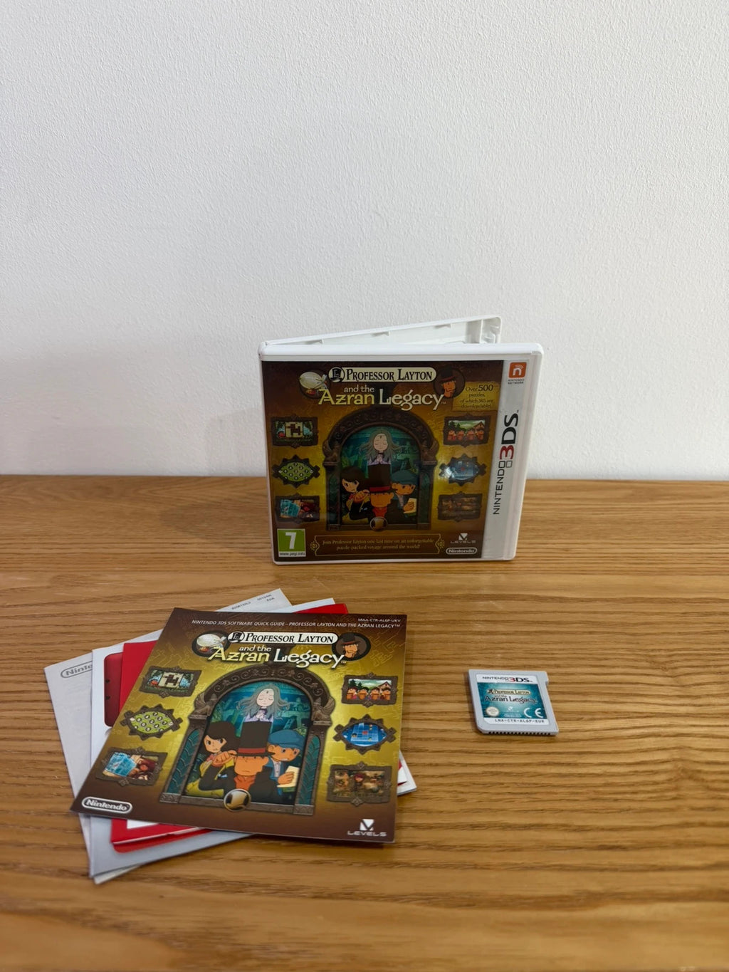 Professor Layton and the Azran Legacy cream Nintendo 3DS game case with manual and cartridge.