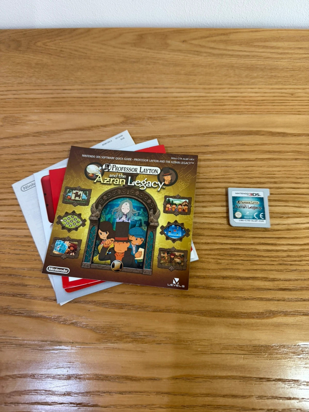 Professor Layton and the Azran Legacy cream Nintendo 3DS game case with manual and cartridge.