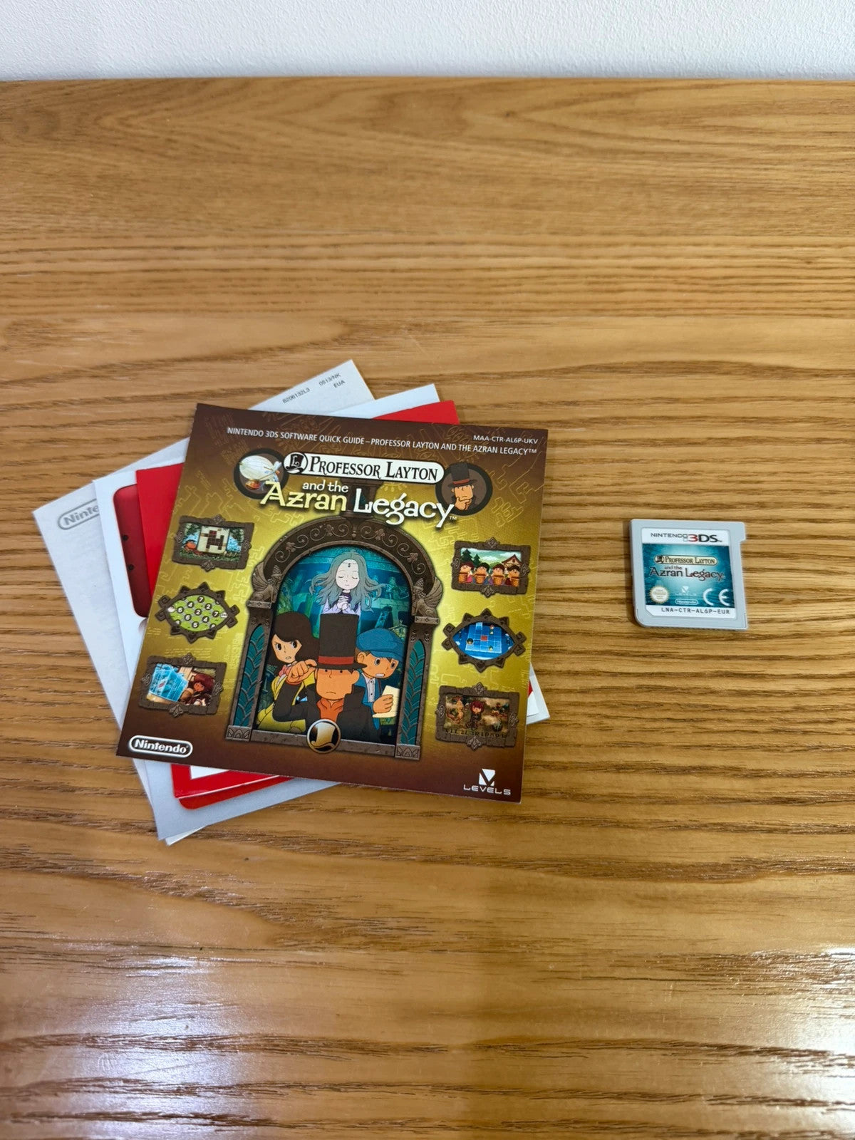Professor Layton and the Azran Legacy cream Nintendo 3DS game case with manual and cartridge.