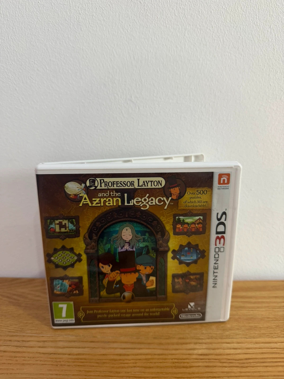 Professor Layton and the Azran Legacy cream Nintendo 3DS game case with manual and cartridge.
