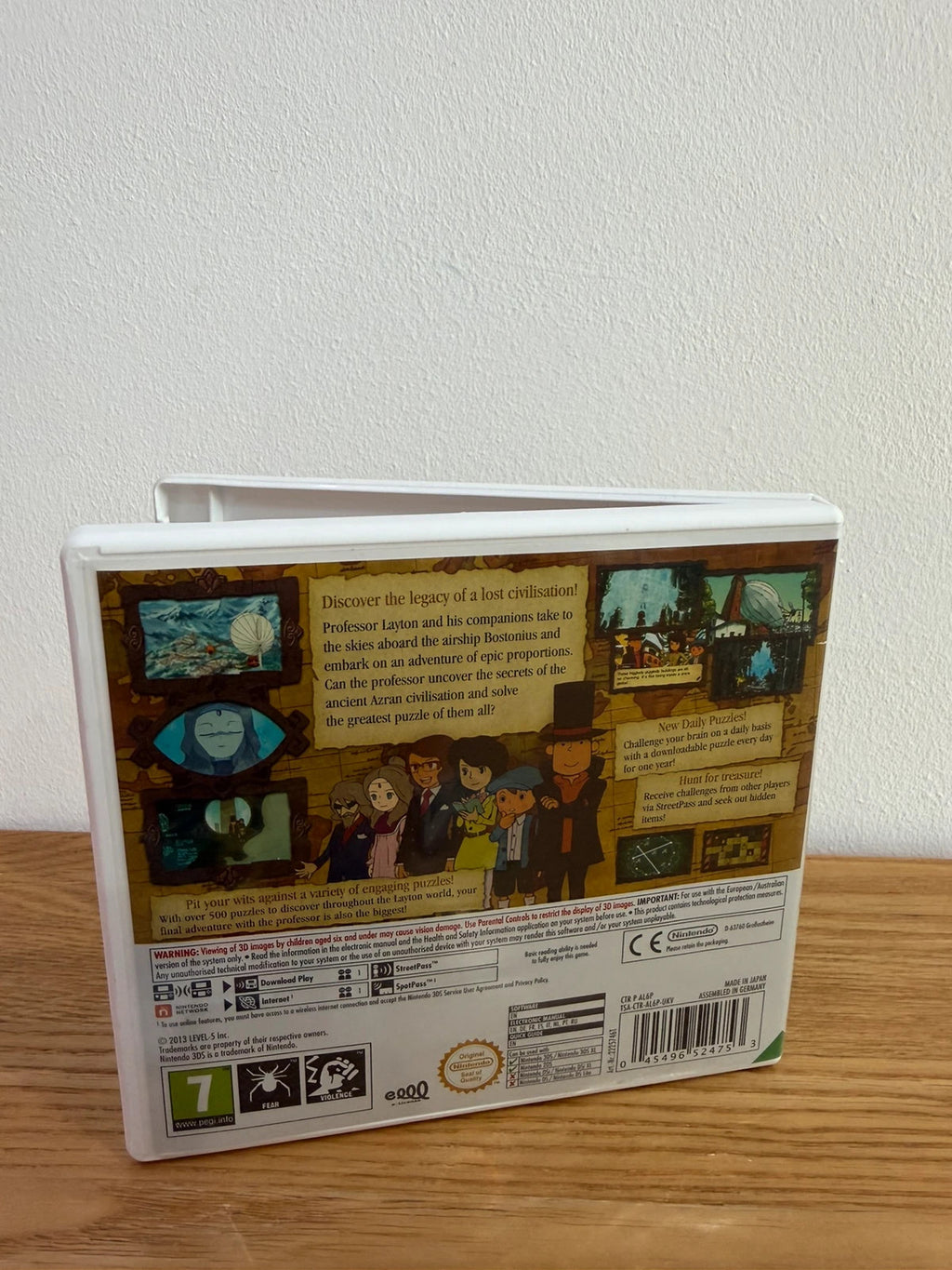 Professor Layton and the Azran Legacy cream Nintendo 3DS game case with manual and cartridge.