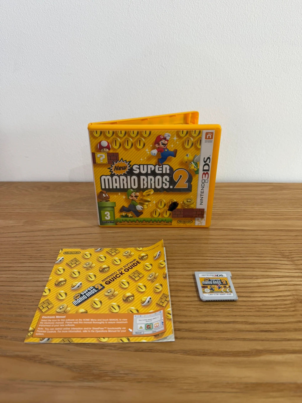 Nintendo 3DS New Super Mario Bros 2 game cartridge with case and manual in very good condition.