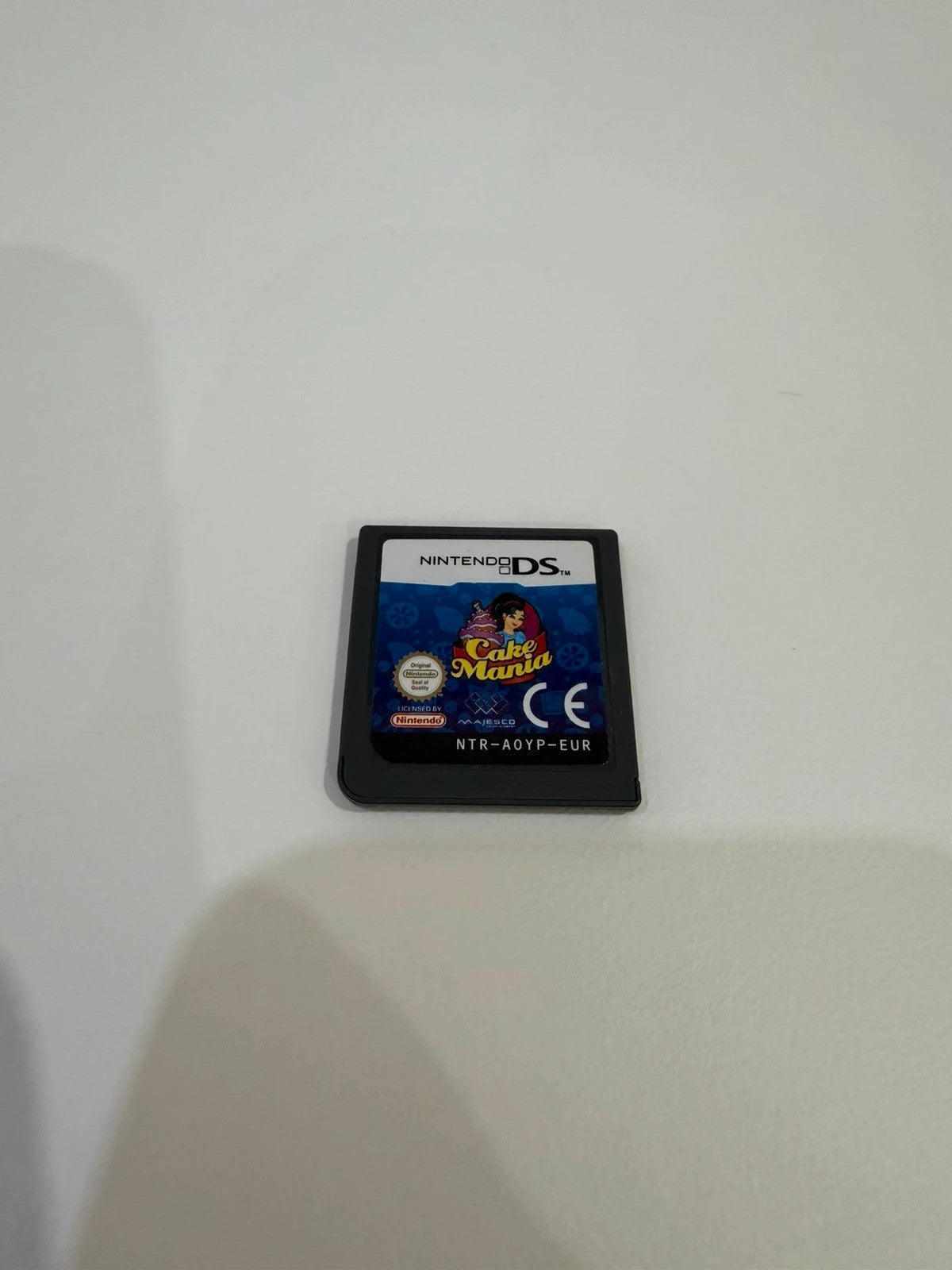 Cake Mania Nintendo DS game cartridge with light signs of previous use.
