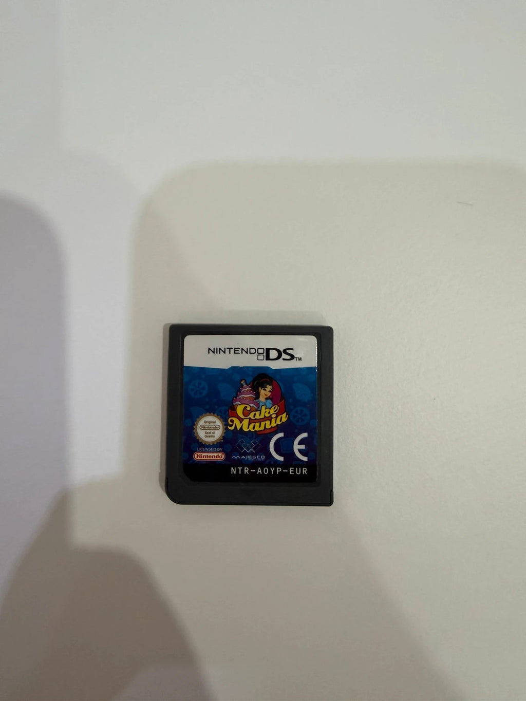 Cake Mania Nintendo DS game cartridge with light signs of previous use.