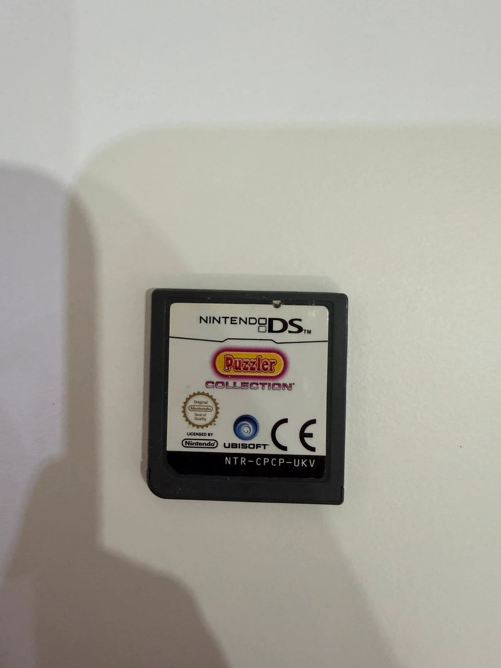 Puzzler Collection Nintendo DS game cartridge with minimal signs of use.