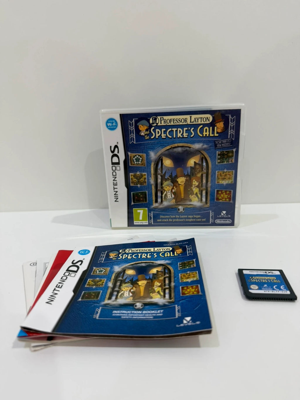 Professor Layton video game cream case with manual and cartridge, very good condition.