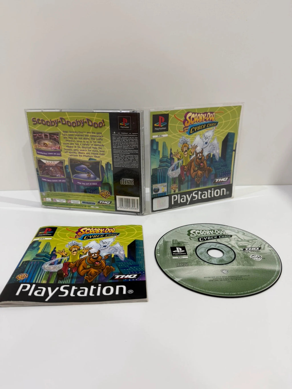 Scooby-Doo video game for PlayStation 1 with colorful cover art and manual.