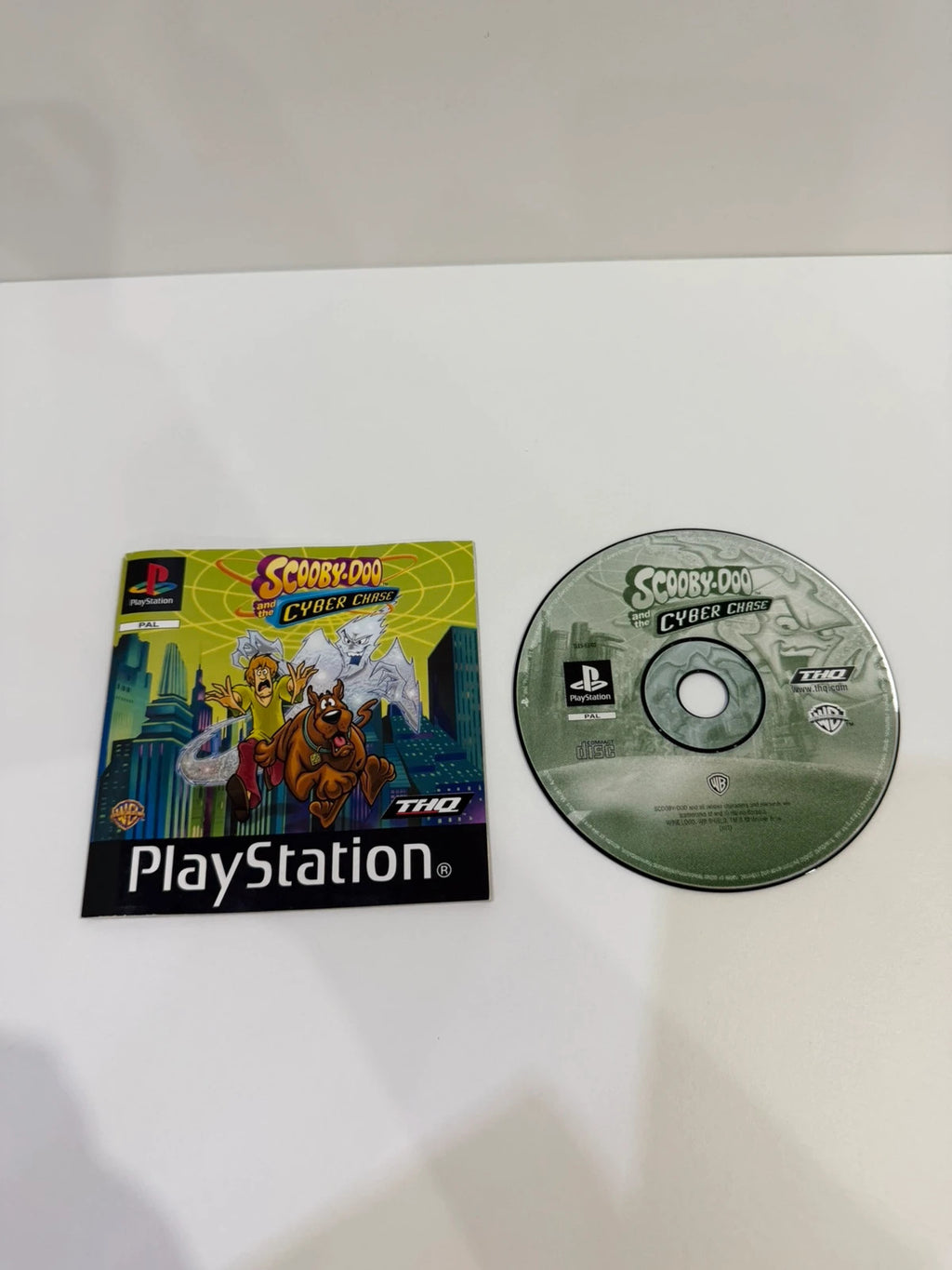 Scooby-Doo video game for PlayStation 1 with colorful cover art and manual.