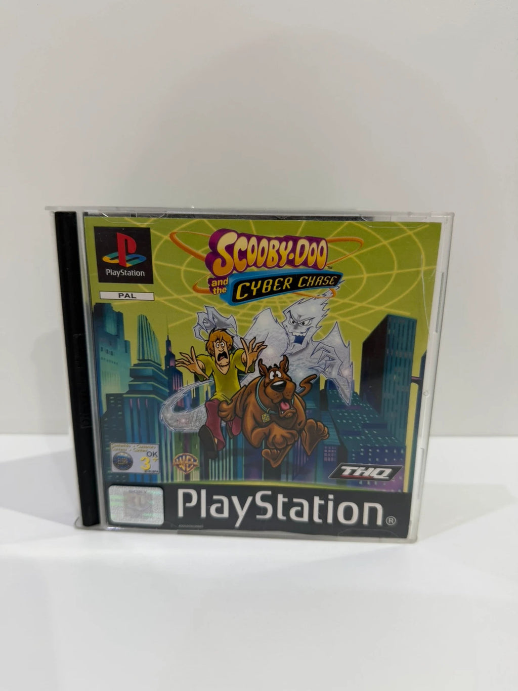 Scooby-Doo video game for PlayStation 1 with colorful cover art and manual.