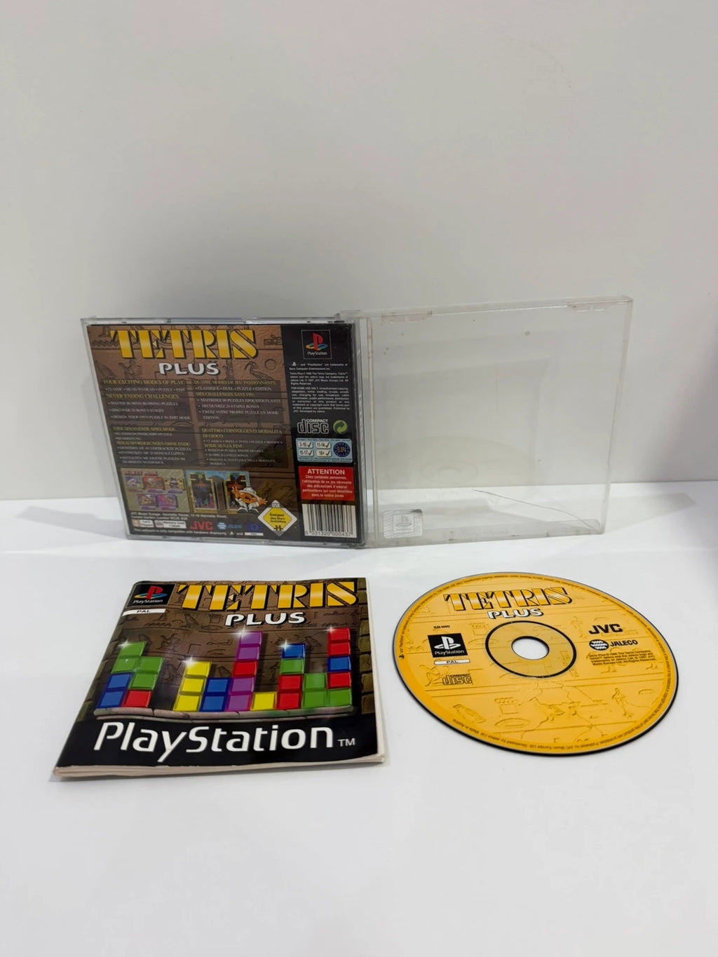 Tetris Plus PS1 video game disc and case with visible crack, no front inlay.