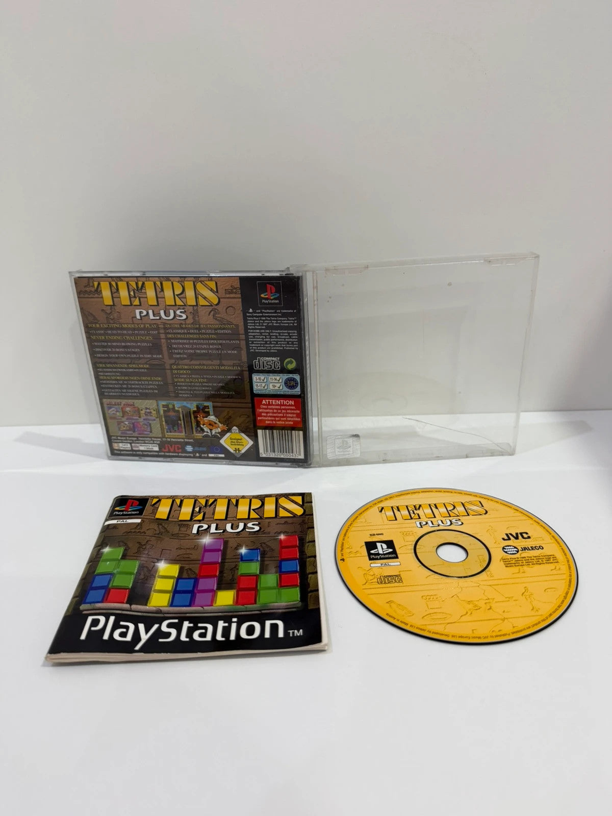 Tetris Plus PS1 video game disc and case with visible crack, no front inlay.