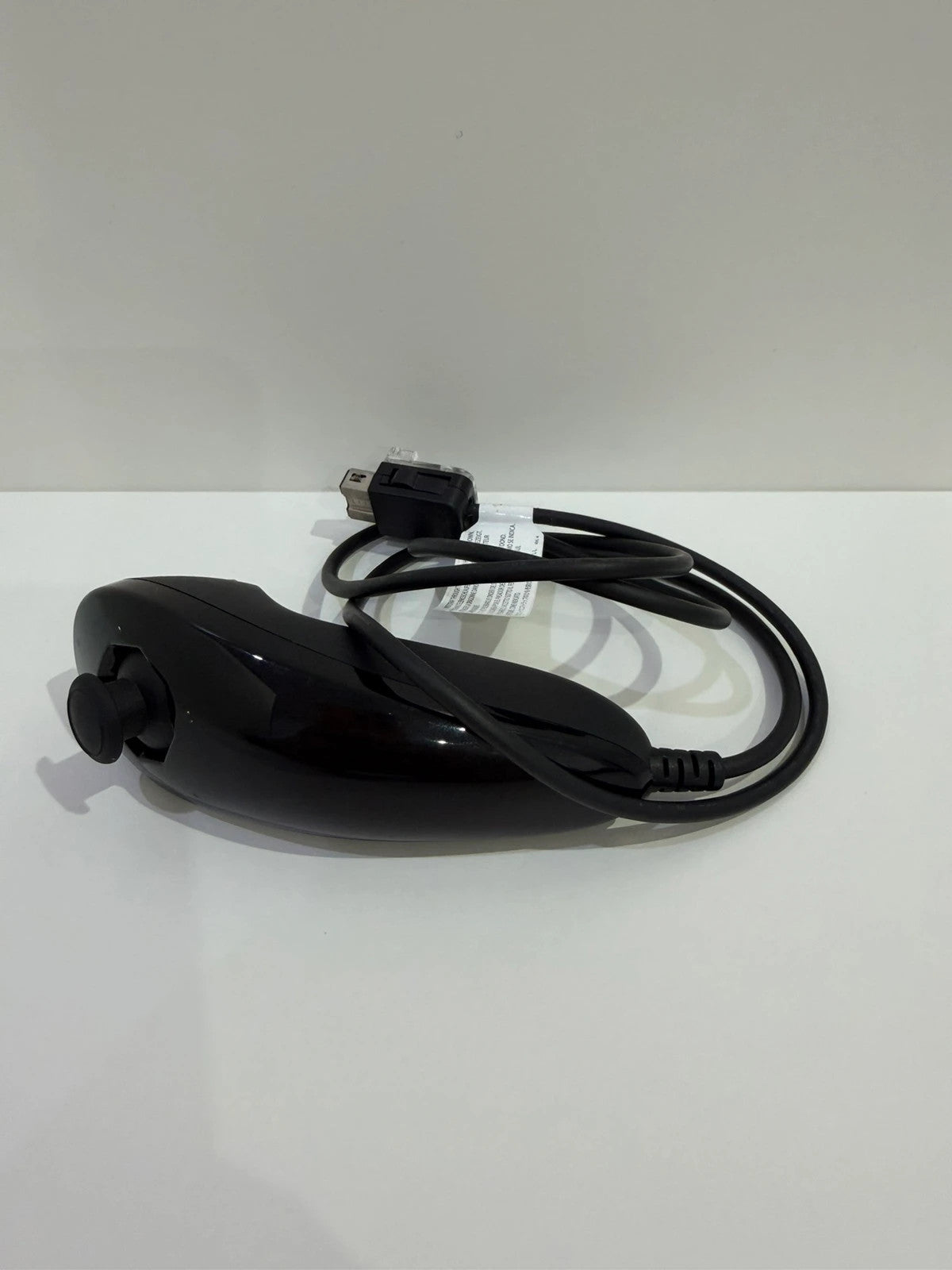 Nintendo black Wii console bundle with official accessories and Wii2HDMI adapter.