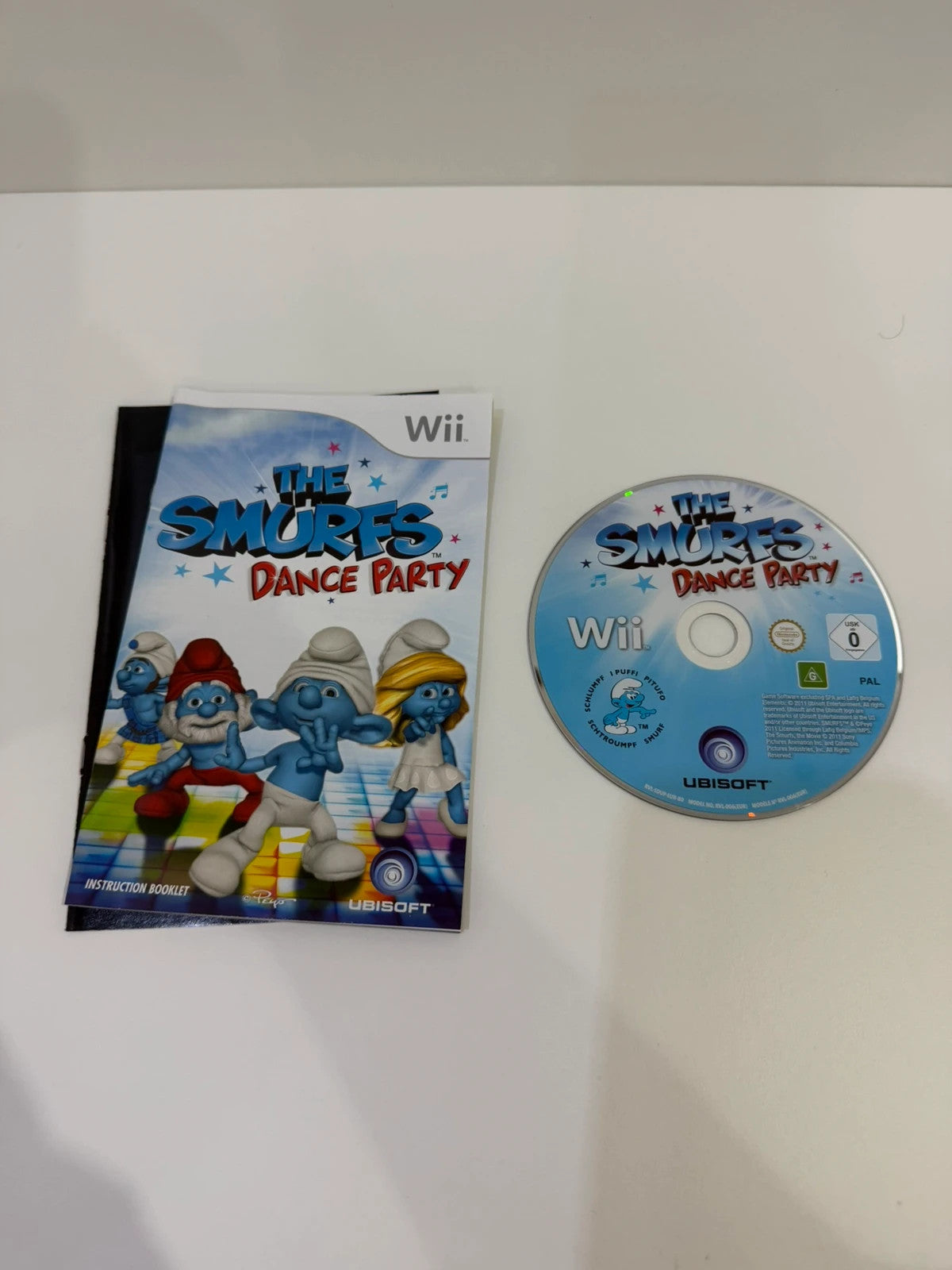 The Smurfs Dance Party Nintendo Wii game complete with manual and colorful cover art.