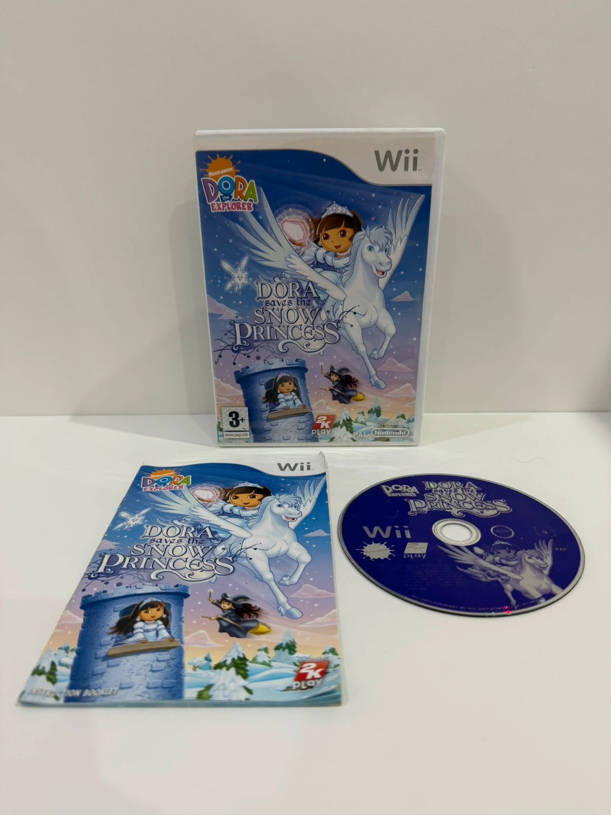 Dora Saves The Snow Princess Nintendo Wii game case with colorful cover art and manual.