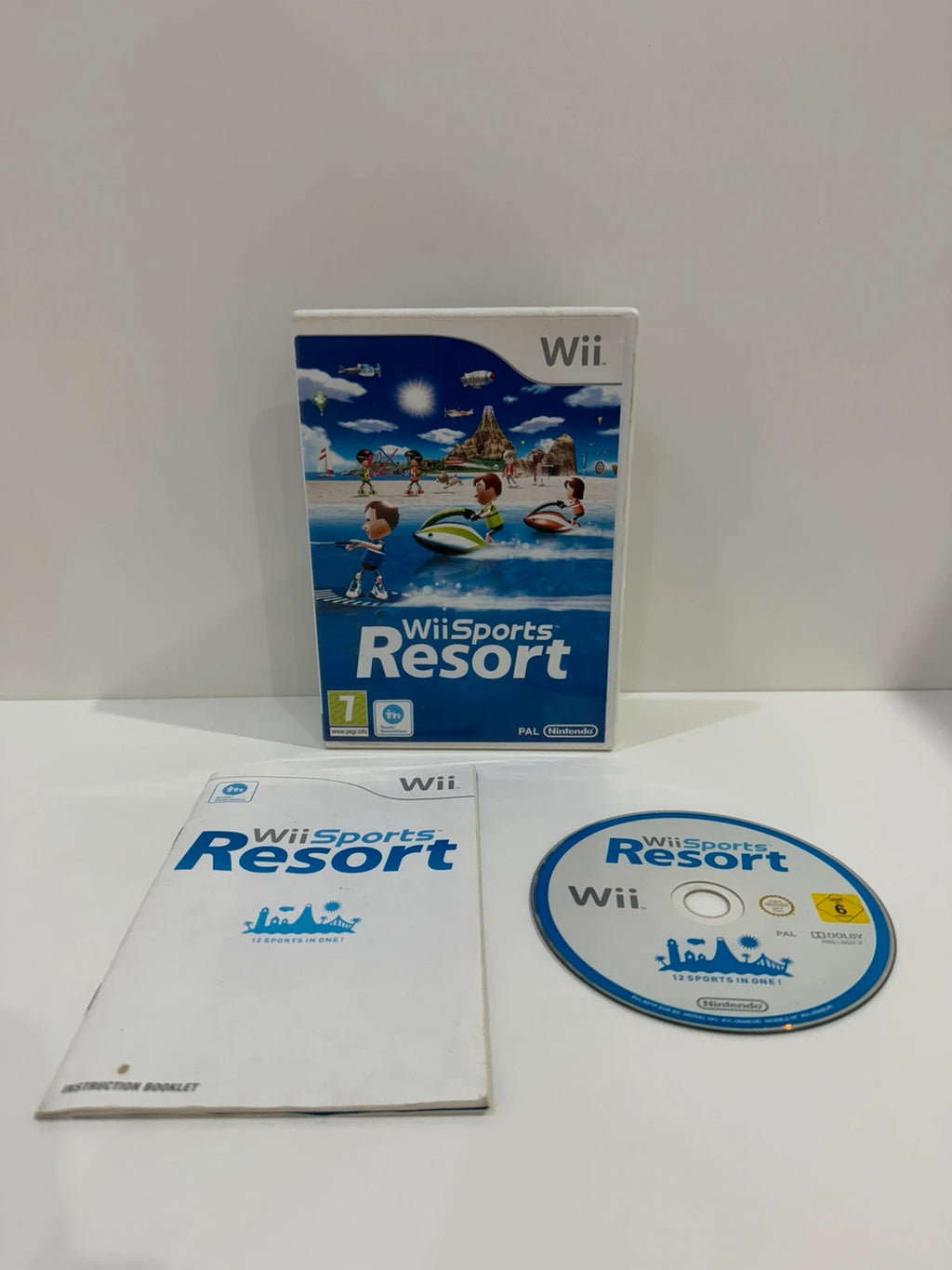 Nintendo Wii Sports Resort game disc with case and manual, very good condition.