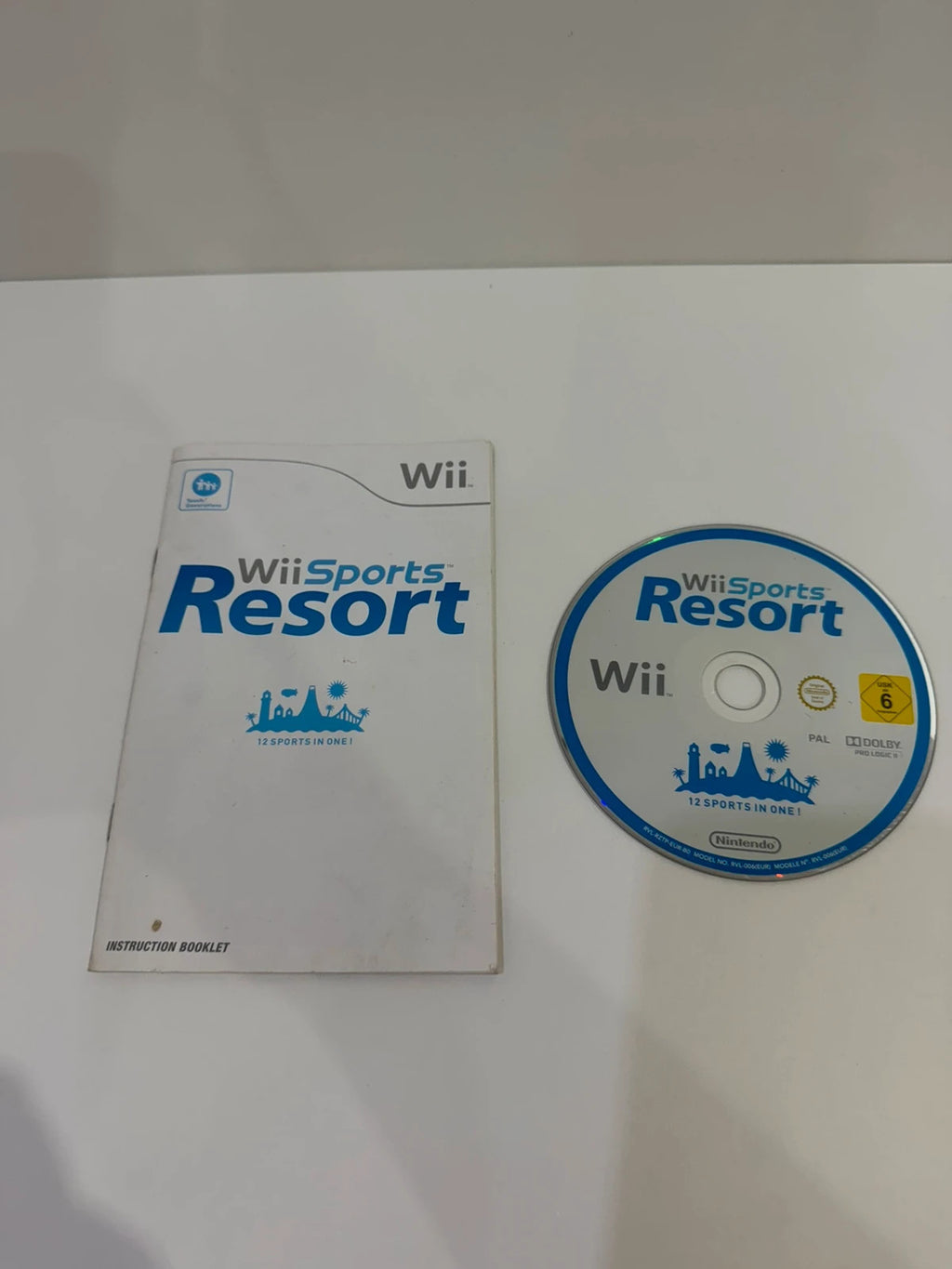 Nintendo Wii Sports Resort game disc with case and manual, very good condition.