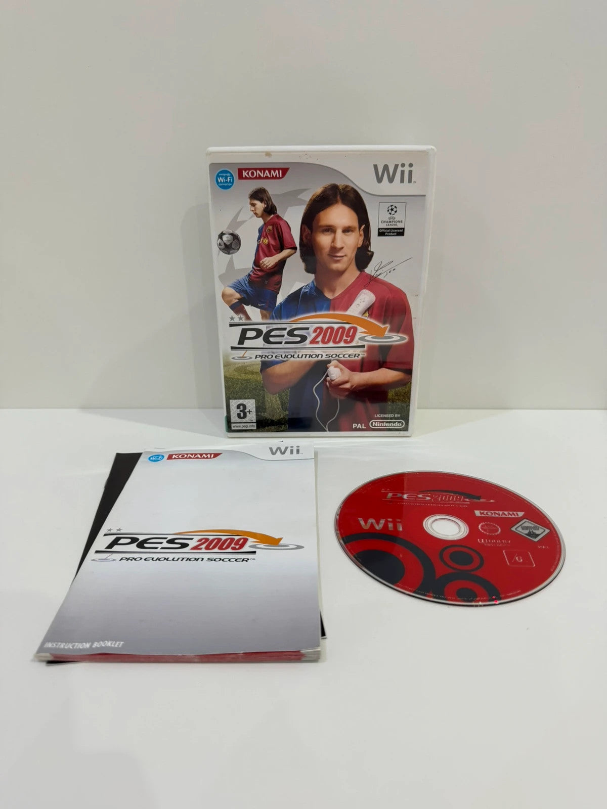 PES 2009 video game for Nintendo Wii, complete with case, manual, and disc.