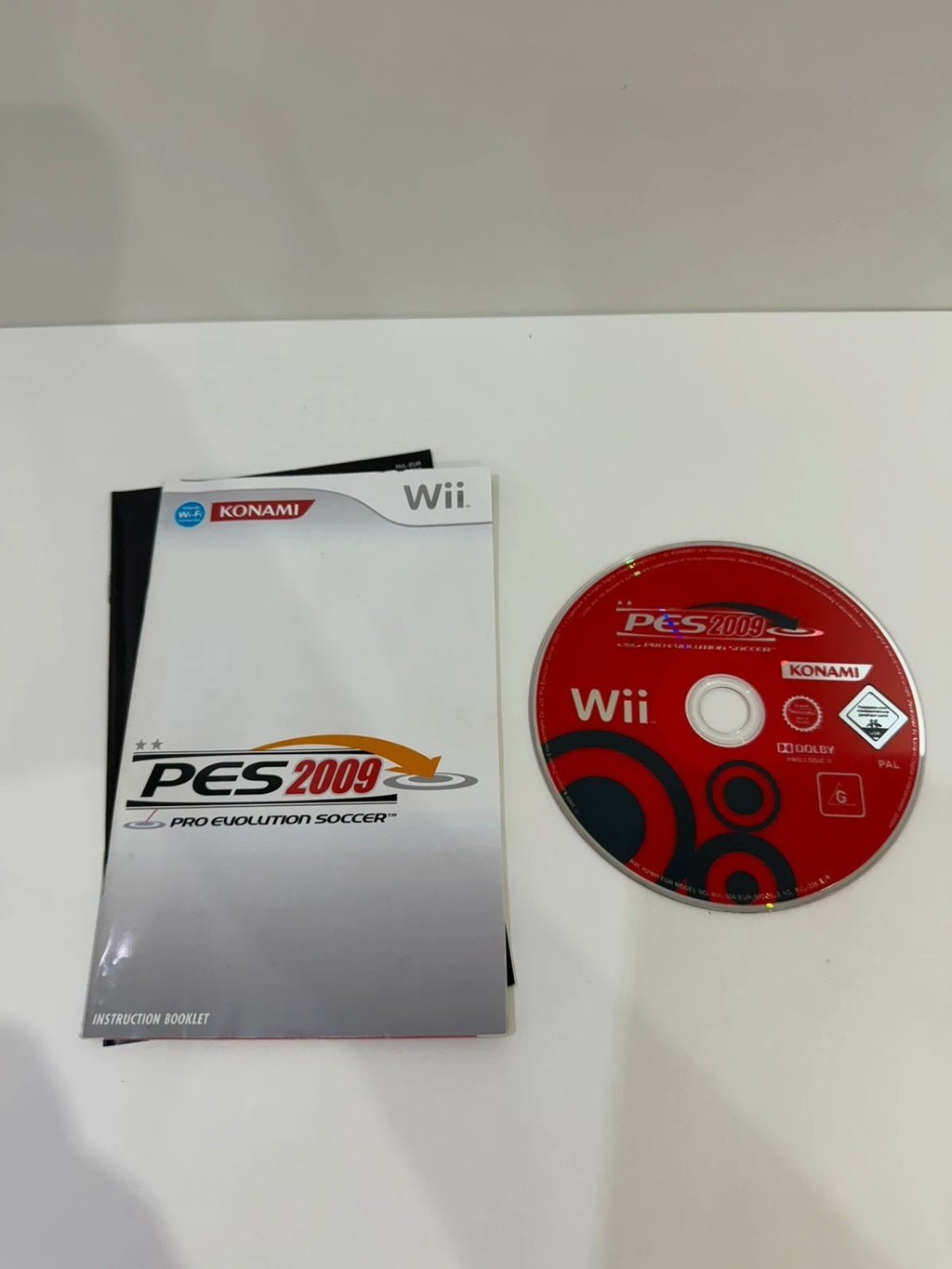 PES 2009 video game for Nintendo Wii, complete with case, manual, and disc.