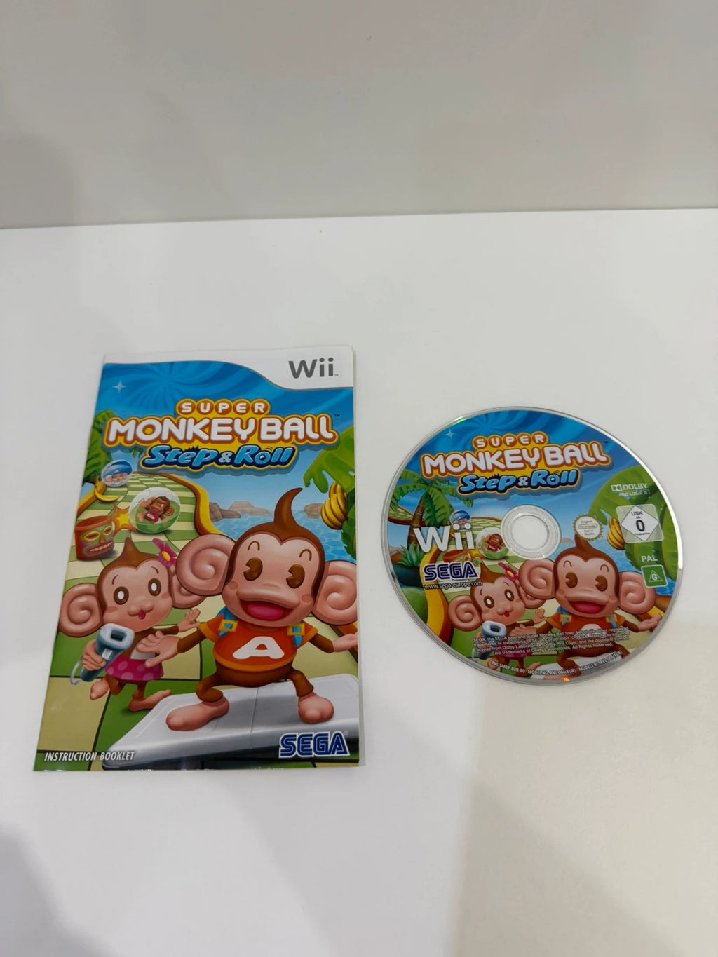 Super Monkey Ball Step & Roll Nintendo Wii game case with manual and disc in very good condition.