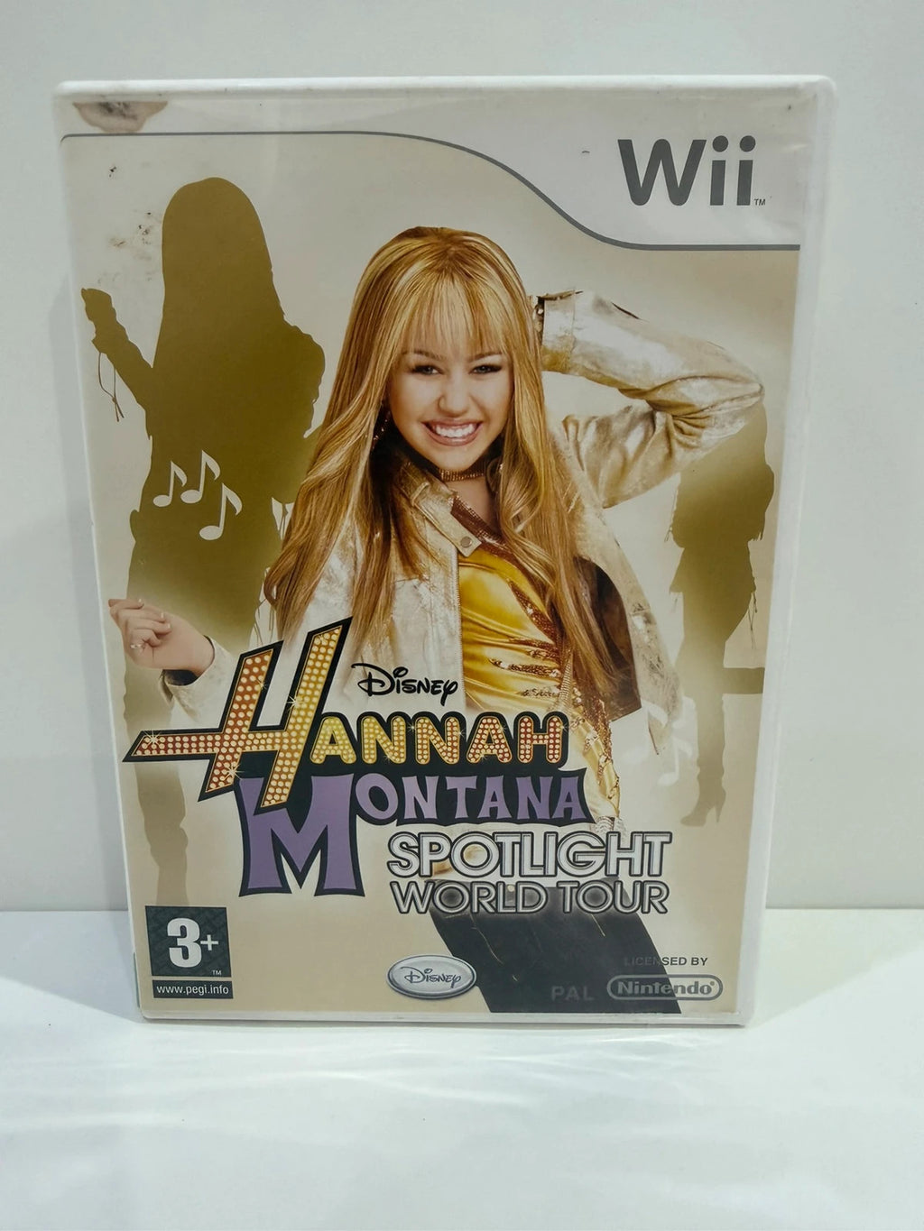 Hannah Montana Spotlight World Tour cream Nintendo Wii game with manual and cover art.
