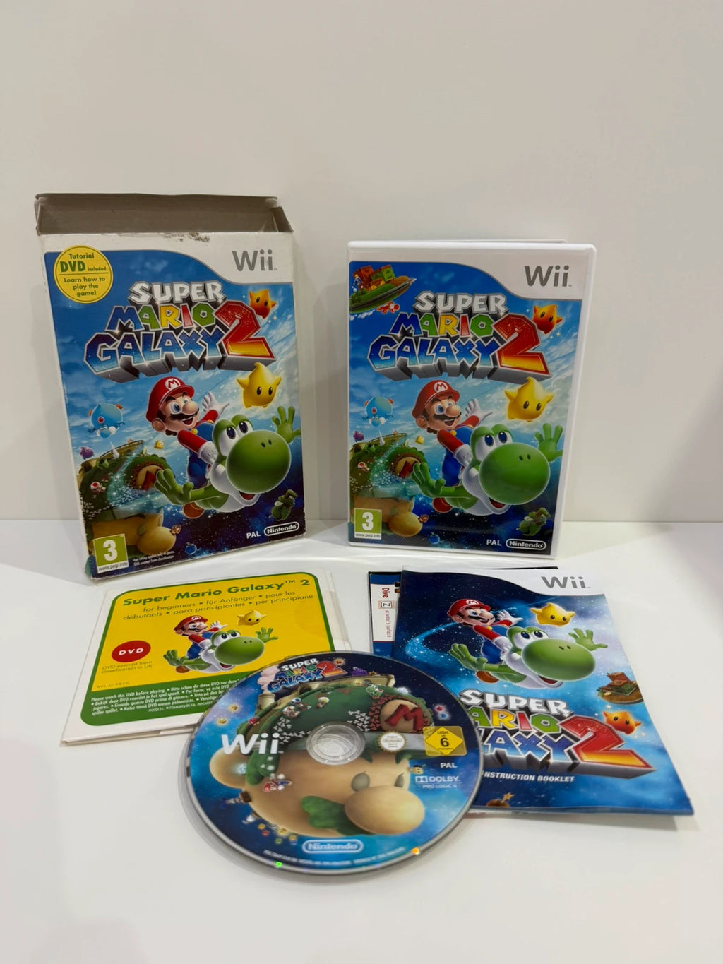 Super Mario Galaxy 2 Nintendo Wii game complete with manual, cardboard sleeve, and sealed DVD.
