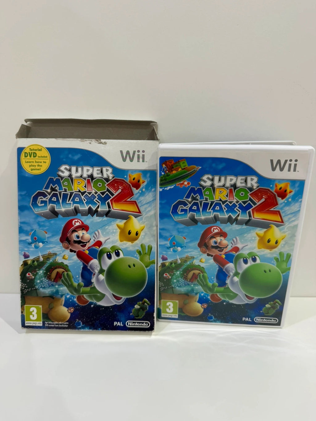 Super Mario Galaxy 2 Nintendo Wii game complete with manual, cardboard sleeve, and sealed DVD.