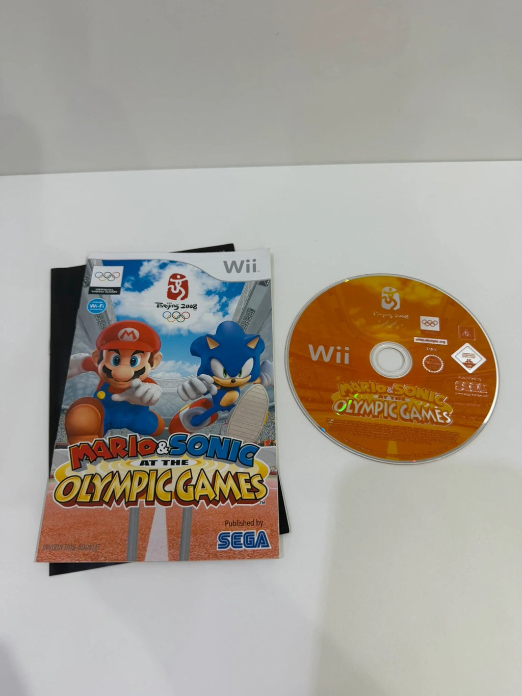 Mario & Sonic at the Olympic Games Nintendo Wii game case with colorful cover art and manual.