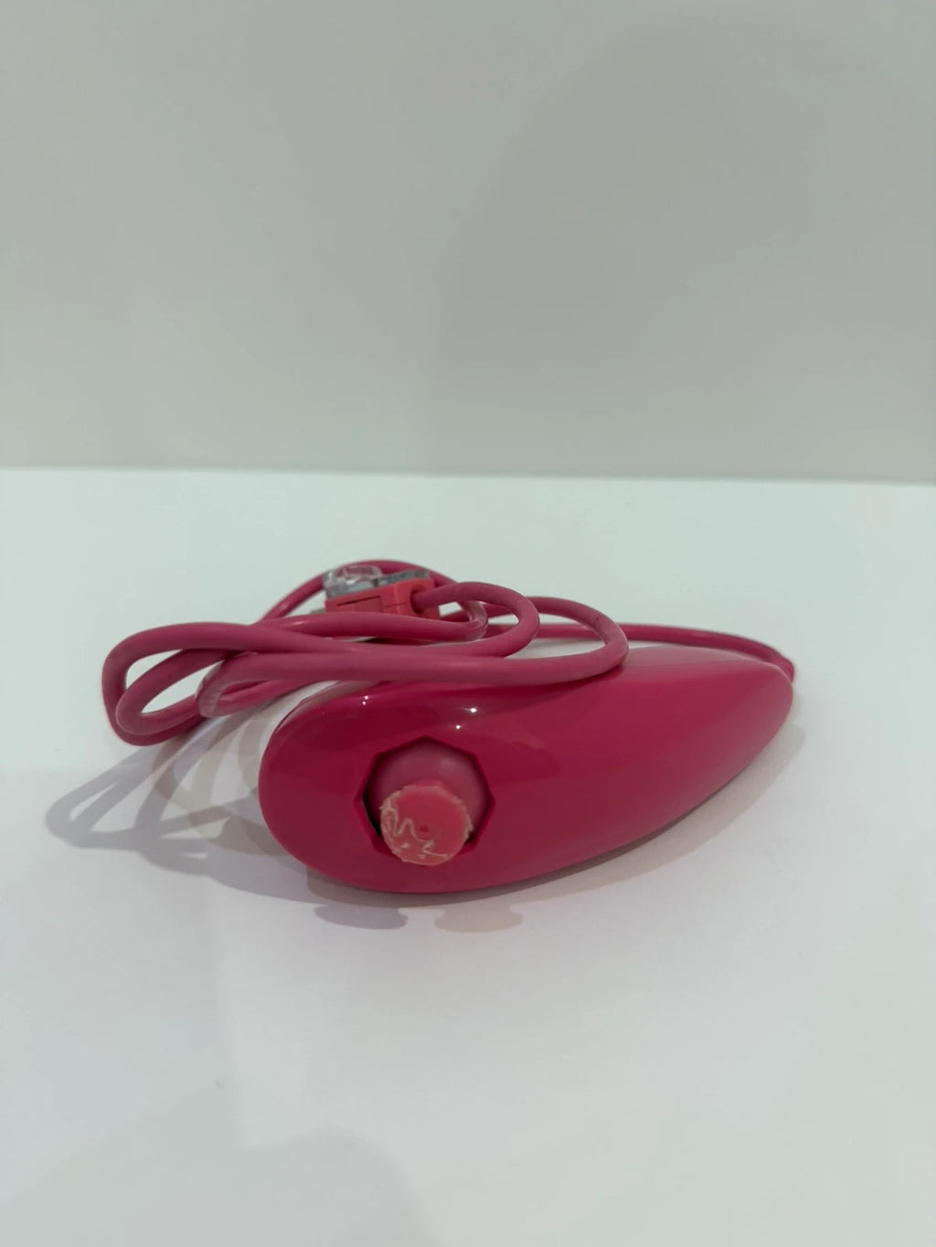 Value pink Wii compatible remote and nunchuk set with ergonomic design and buttons.