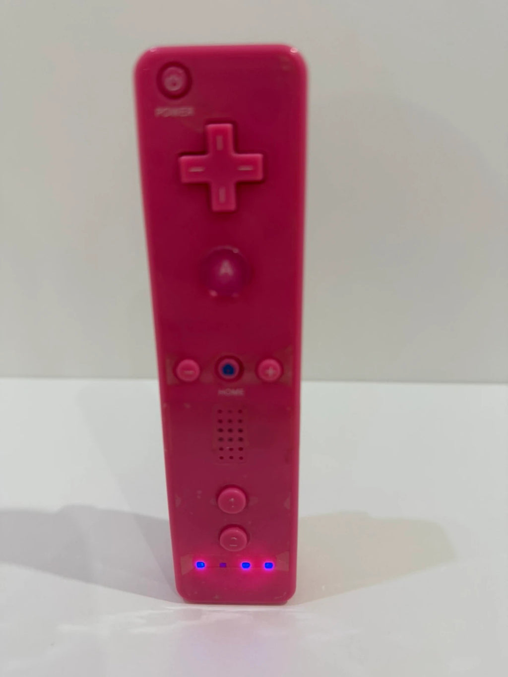 Value pink Wii compatible remote and nunchuk set with ergonomic design and buttons.