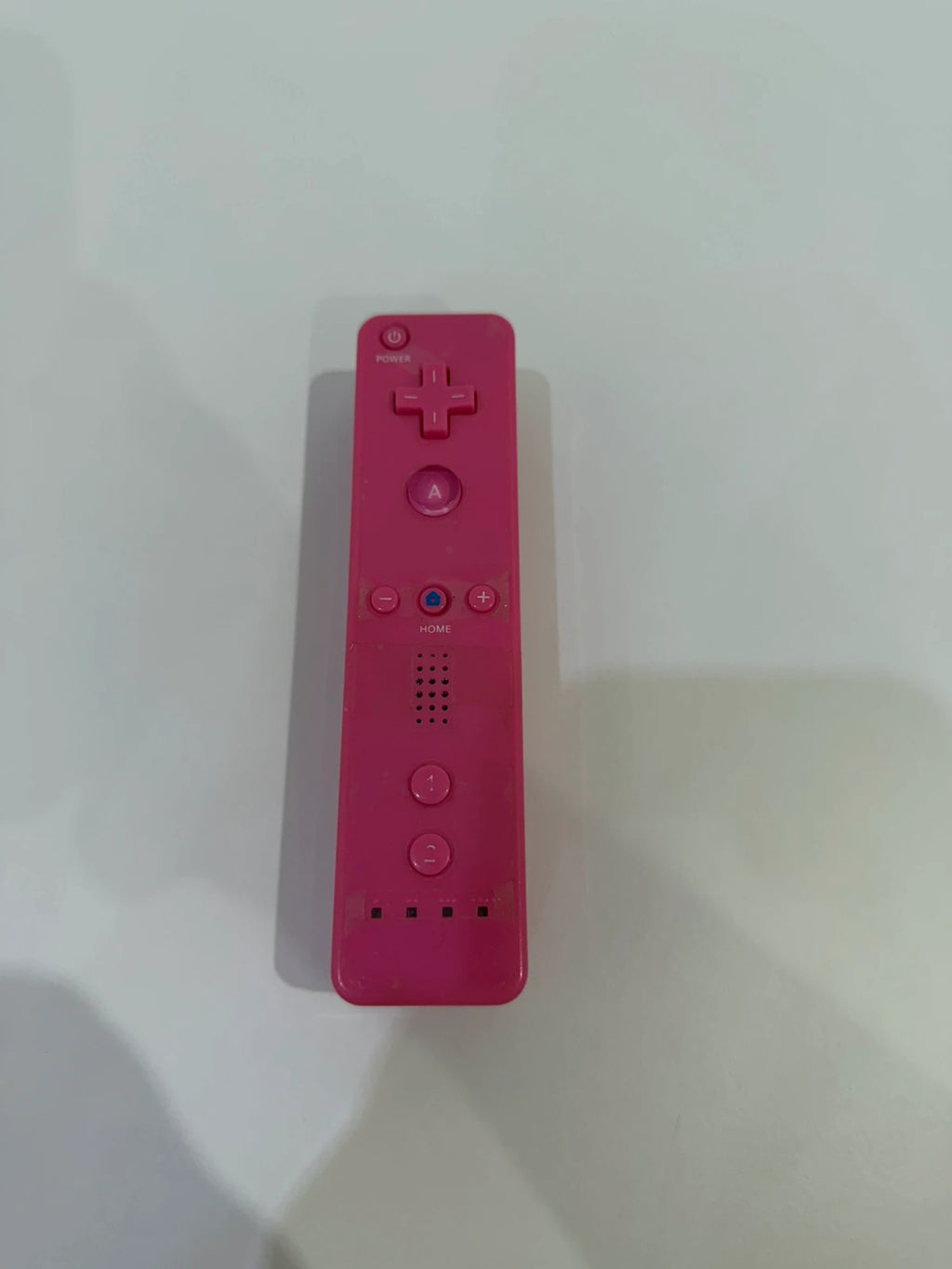 Value pink Wii compatible remote and nunchuk set with ergonomic design and buttons.