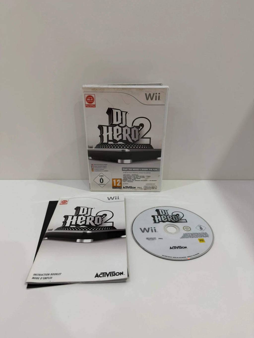 DJ Hero 2 video game for Nintendo Wii with complete manual and damaged case.