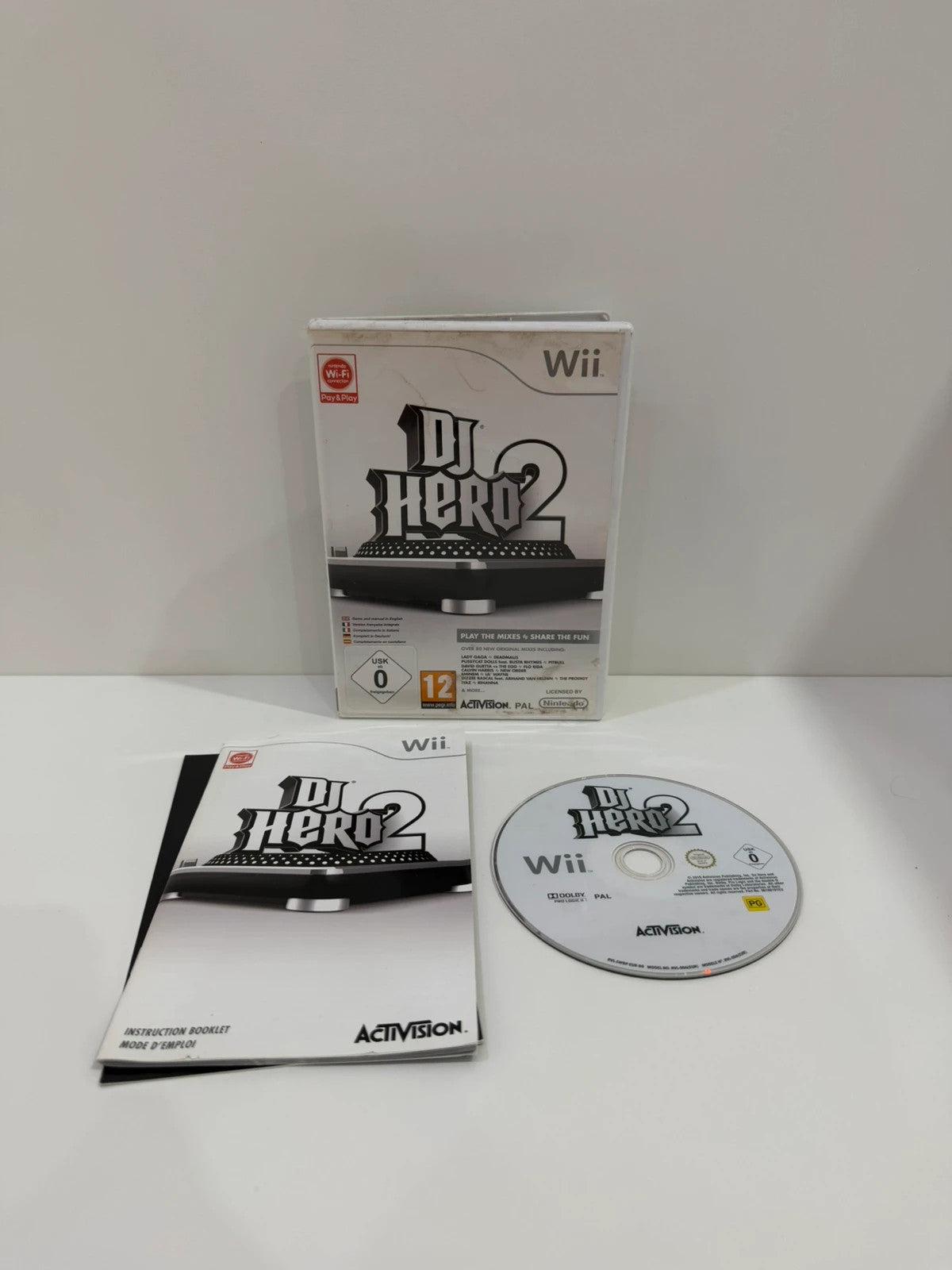 DJ Hero 2 video game for Nintendo Wii with complete manual and damaged case.