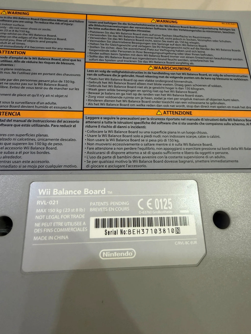 Nintendo Wii Fit Balance Board white with original box, game discs, and booklets.