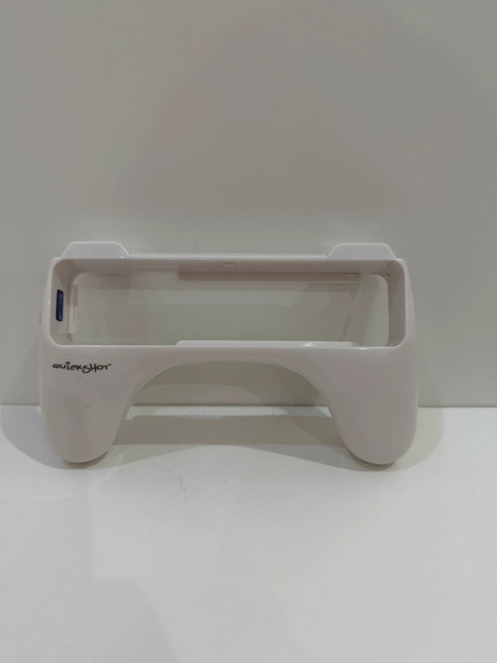Value white Wii remote attachment with ergonomic design and compatibility for Nintendo Wii.