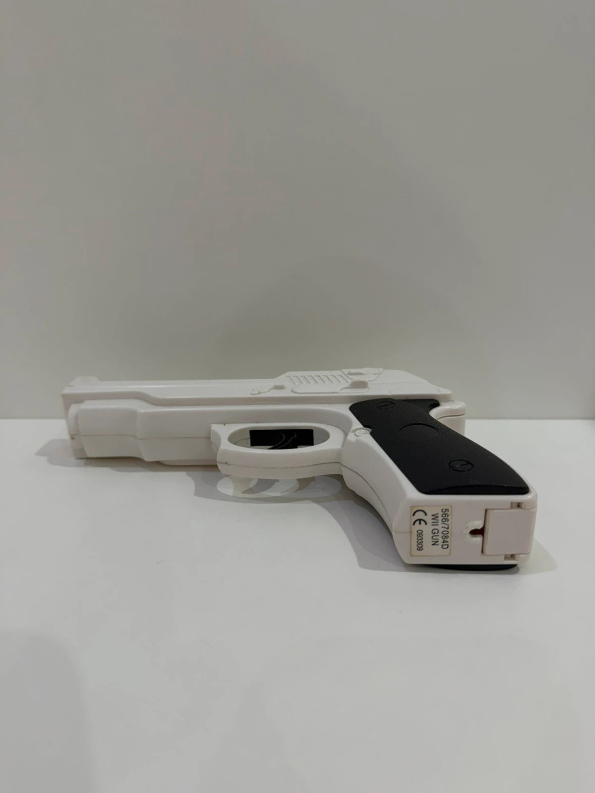 Value white hat with Nintendo Wii logo and gun controller design.